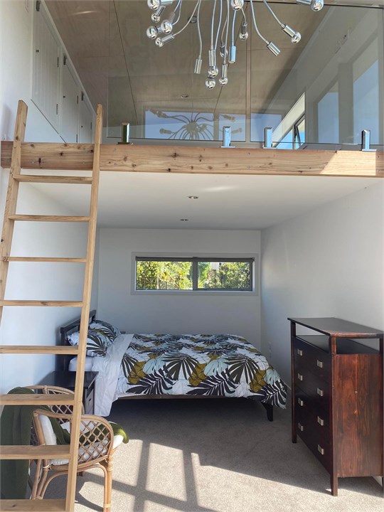 Studio room with queen bed below and 2 single matt