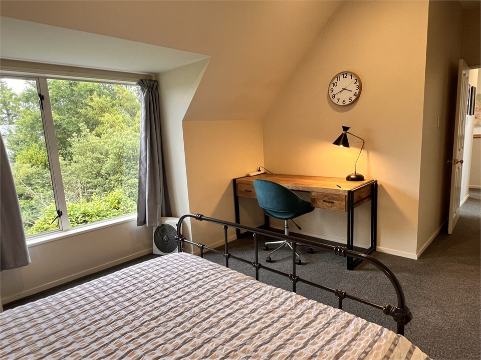 Bedroom 2 has a Queen bed and a desk