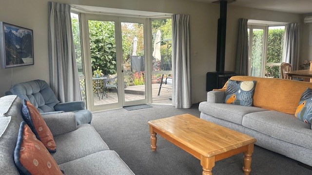 Lounge with french doors opening to the deck and g