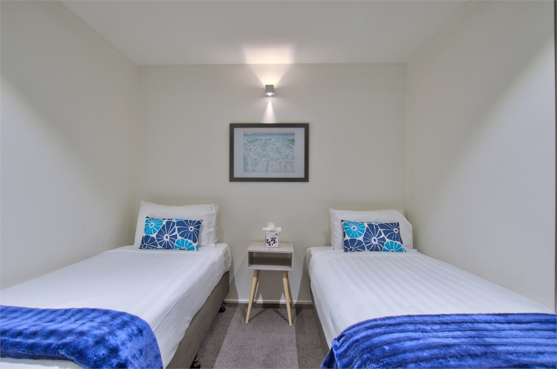 Third bedroom with two king single beds.