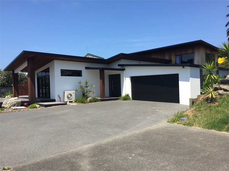Front view of house (now fenced around deck area)
