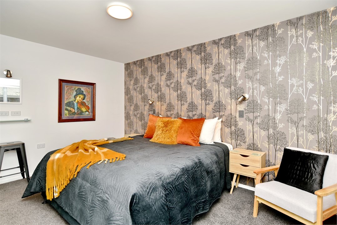 Bedroom 1 has a King sized bed and a sitting area