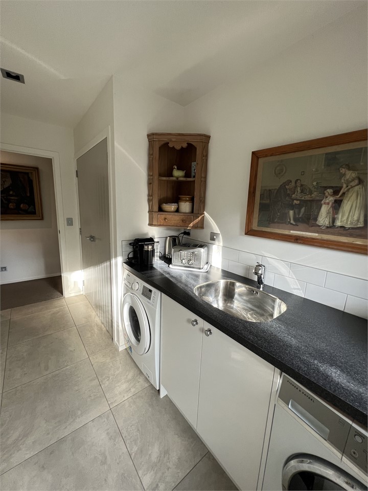 Kitchenette with washing machine and drier