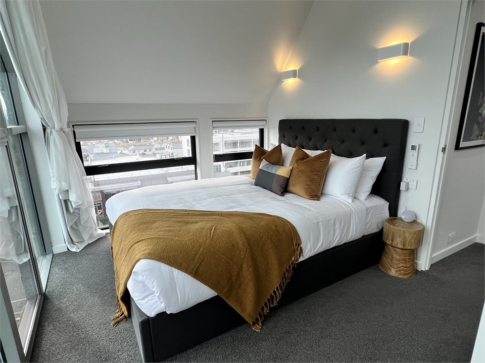 Master bedroom has a Queen bed with a view