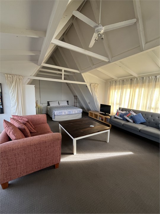 Upstairs bedroom (past curtains)