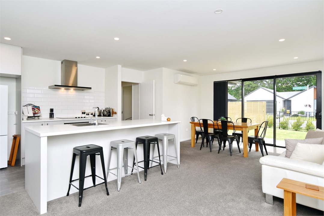 Fully equipped Kitchen area with seating at the be