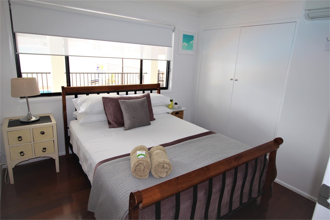 Queen Bed, pool views and aircon