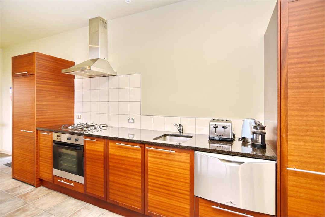 Fully quipped kitchen with a sitting area at the b