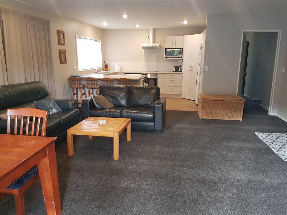Living room with dining and kitchen