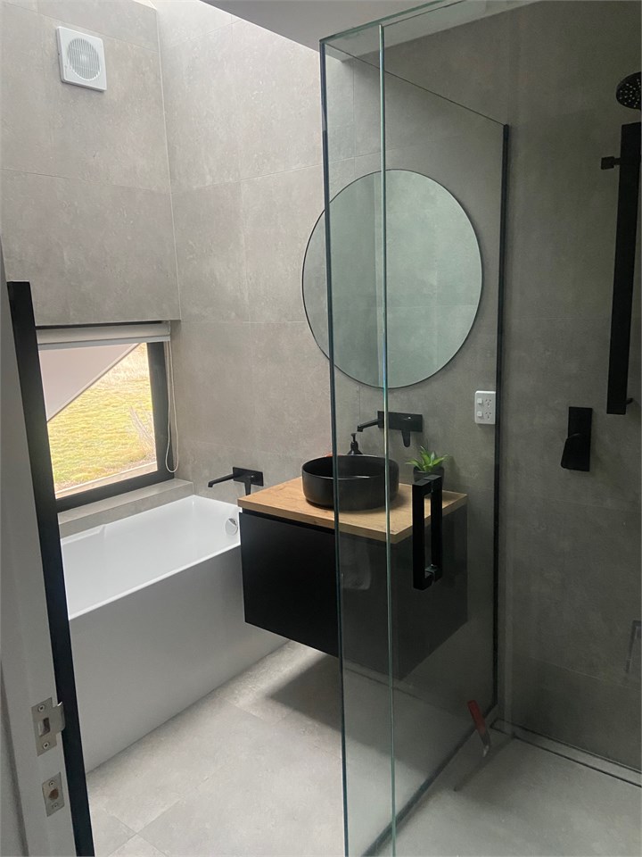 Separate bathroom with bath
