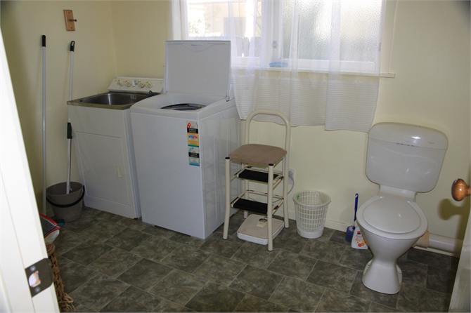 Downstairs laundry and extra toilet