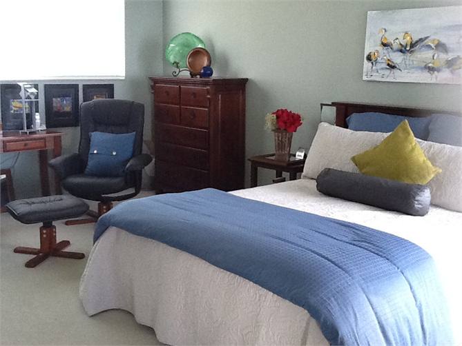 Master Bedroom has 2 comfy chairs with Bay views