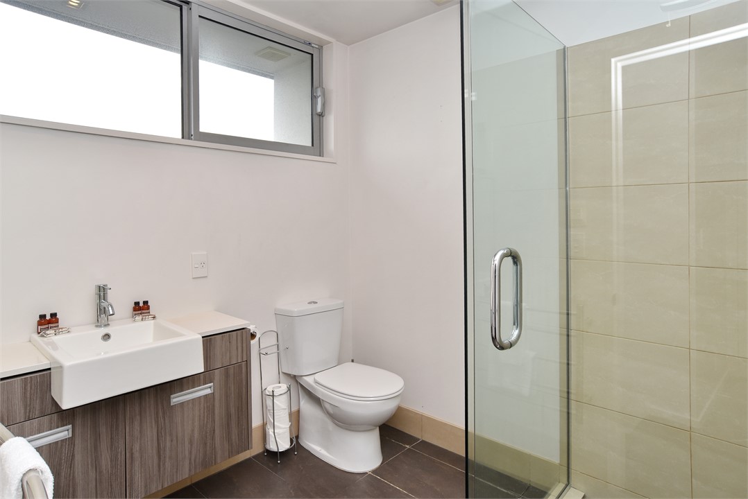 Bathroom 2 has a shower and a toilet