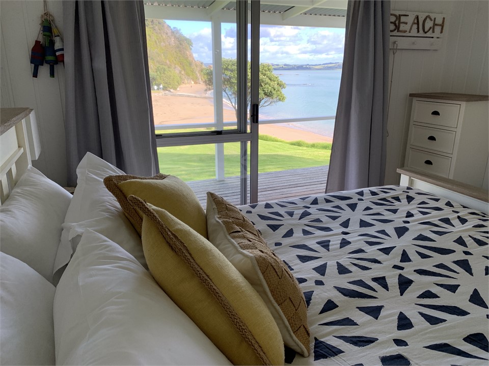 Comfy new queen bed and the sound of the waves