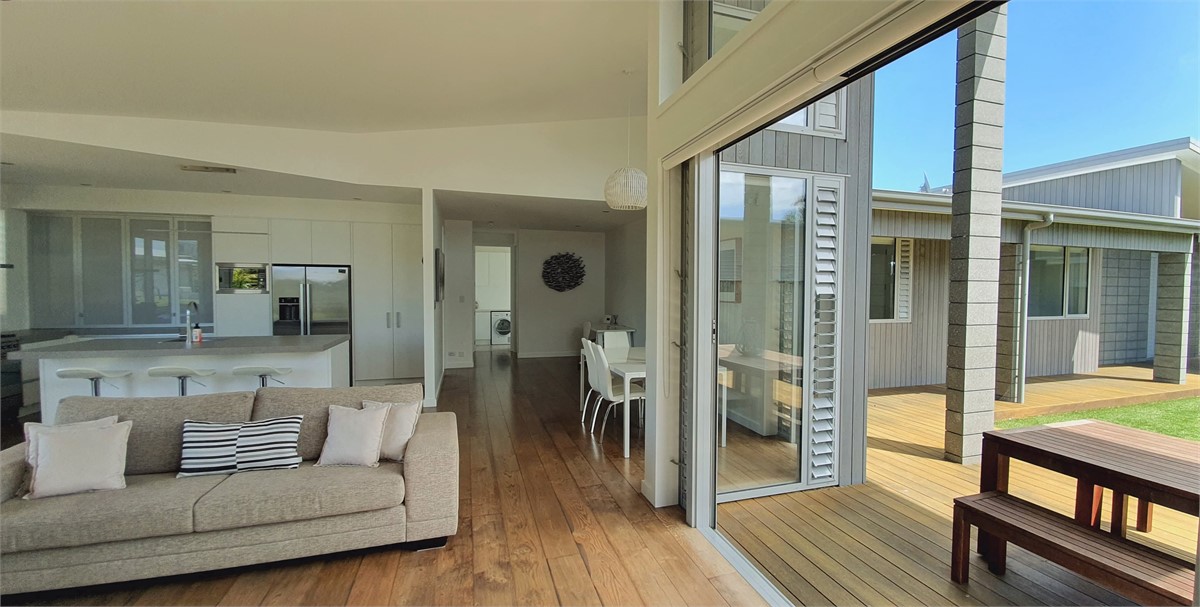 Opens out to decks on both sides