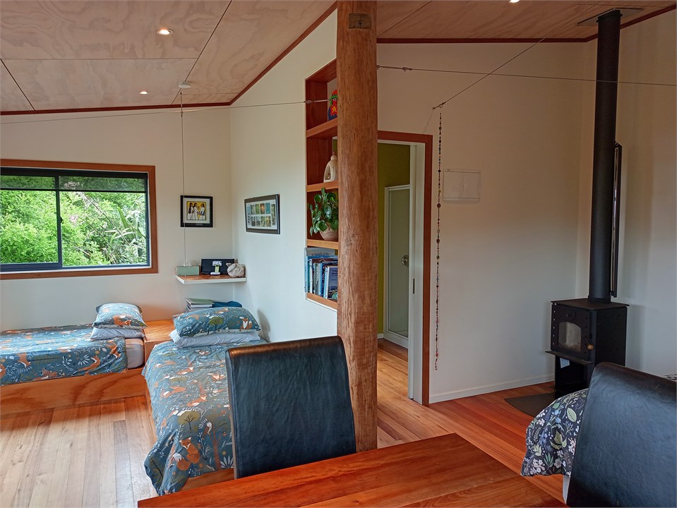 Dining area, studio space, woodburner and bathroom