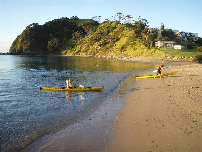 Sandy beach with Tapeka Point in the background