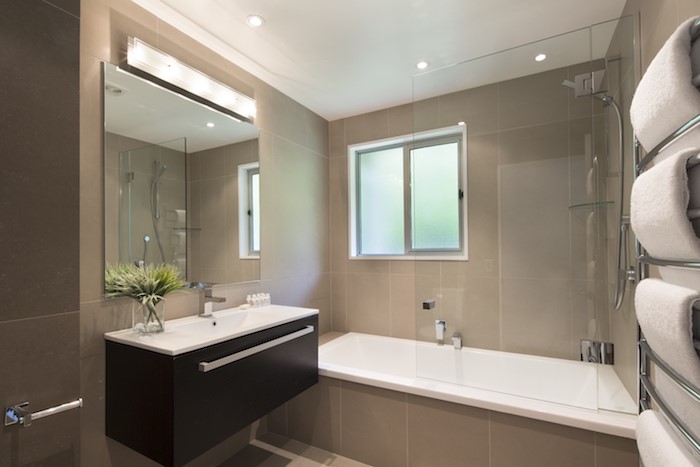 Full bathroom with a bathtub