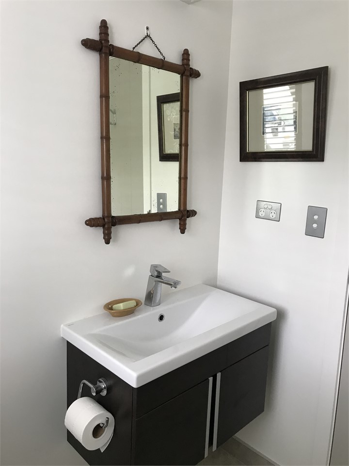 Guest bathroom with vanity and toilet