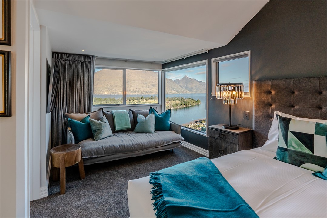 A luxurious master bedroom with stunning views