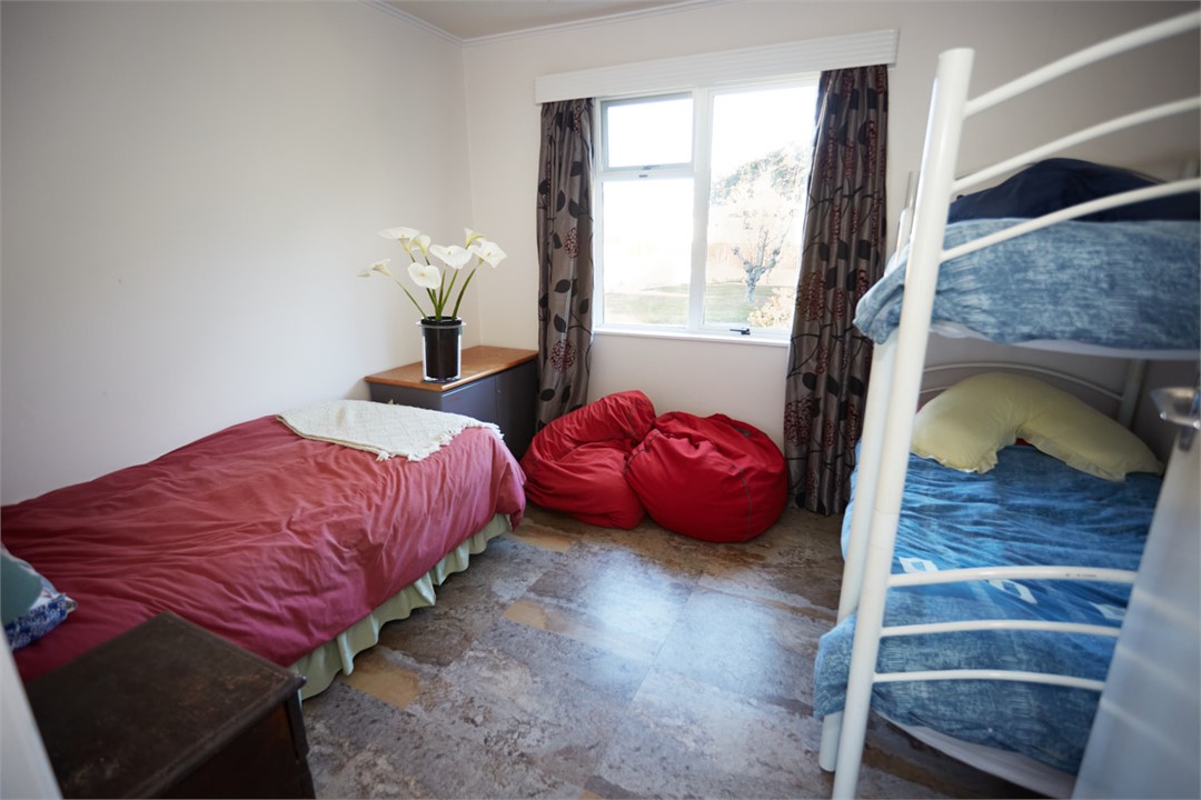 Second inside bedroom with king single and bunks.