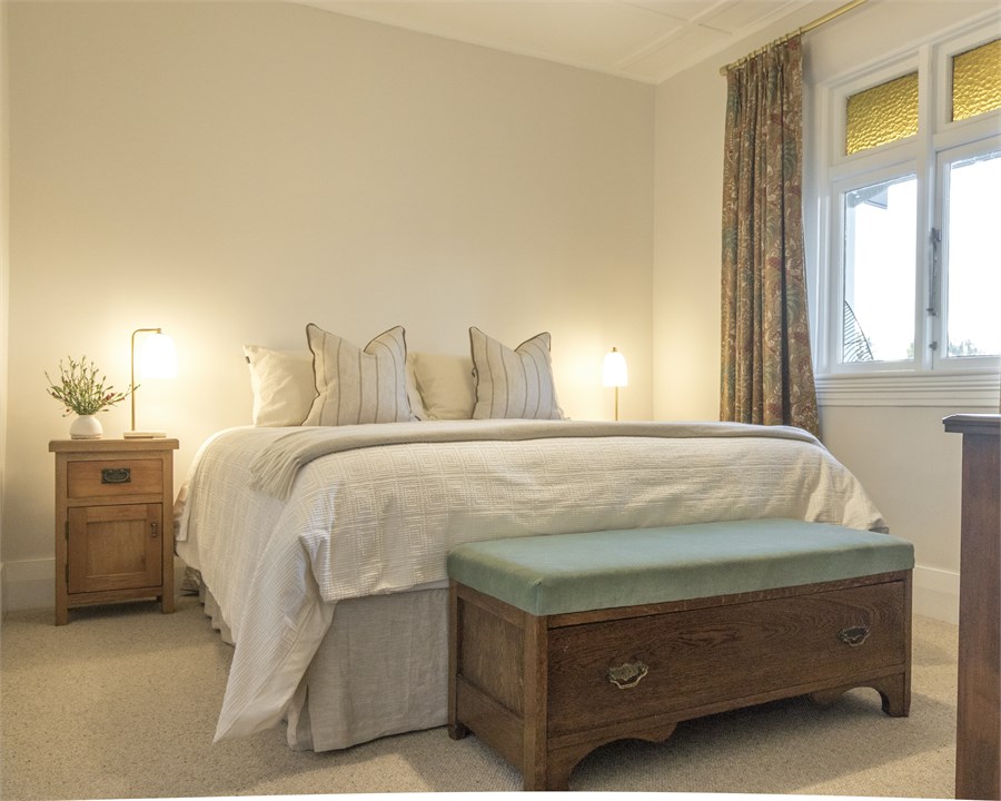 The master bedroom has a king bed.