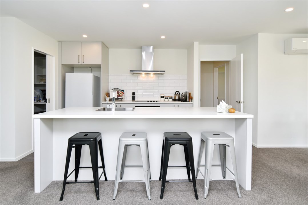Fully equipped Kitchen area with seating at the be