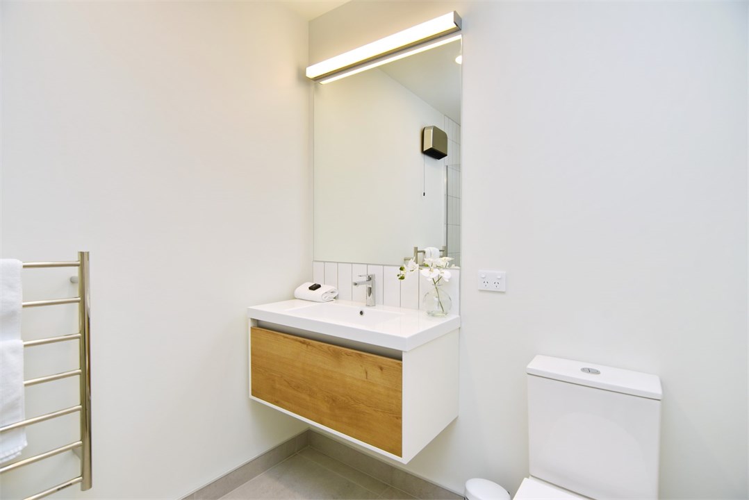 Bathroom has a shower and a toilet