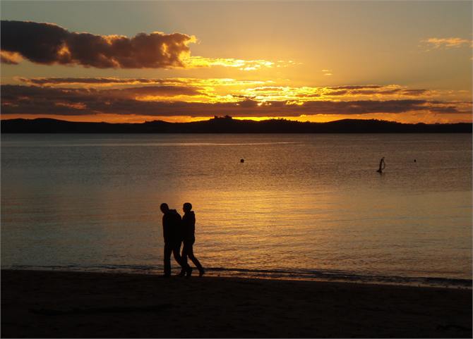 Stroll along the beach at sunset.
