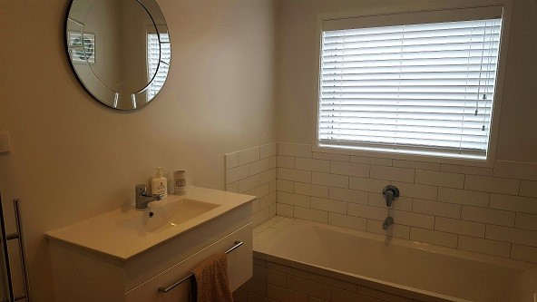 Downstairs bathroom with bath and shower