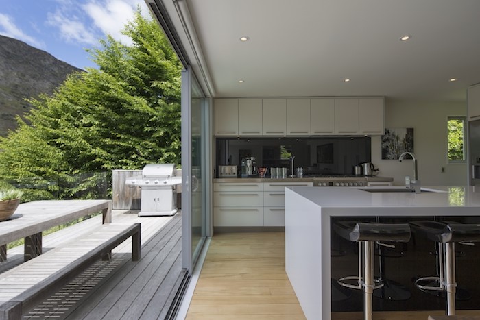Open plan kitchen leading out into the deck and ou