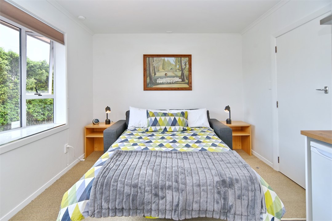 Sofa in living area that pulls out to a double bed