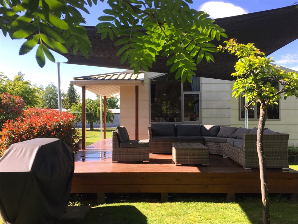 Deck area with outdoor furniture and BBQ