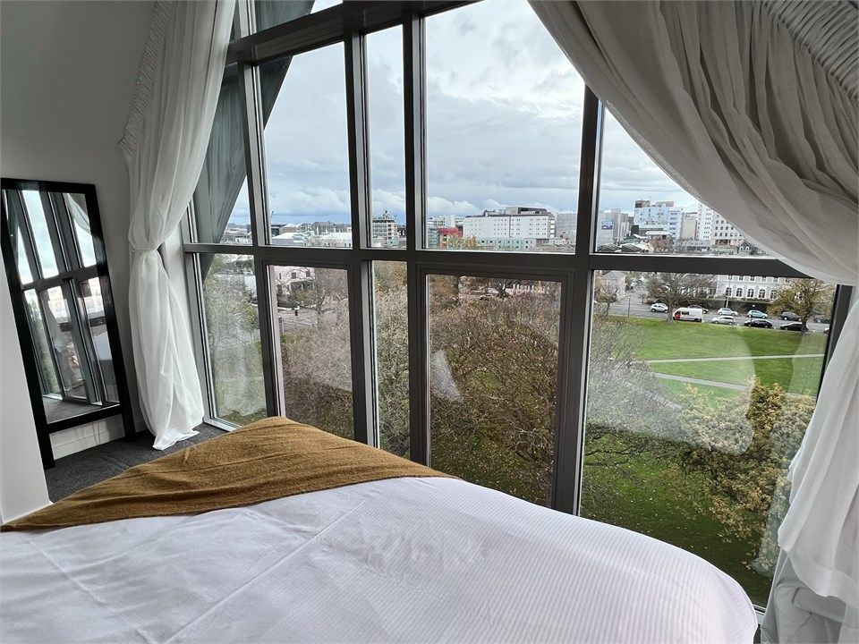 Master bedroom has a Queen bed with a view