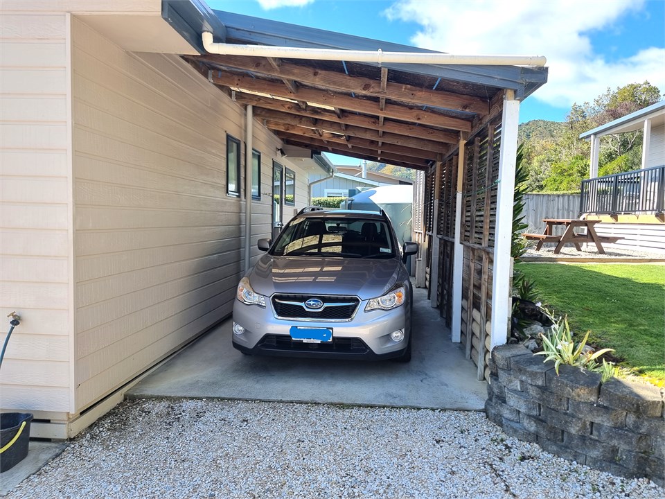 Both cottages have a carport and parking for a sec