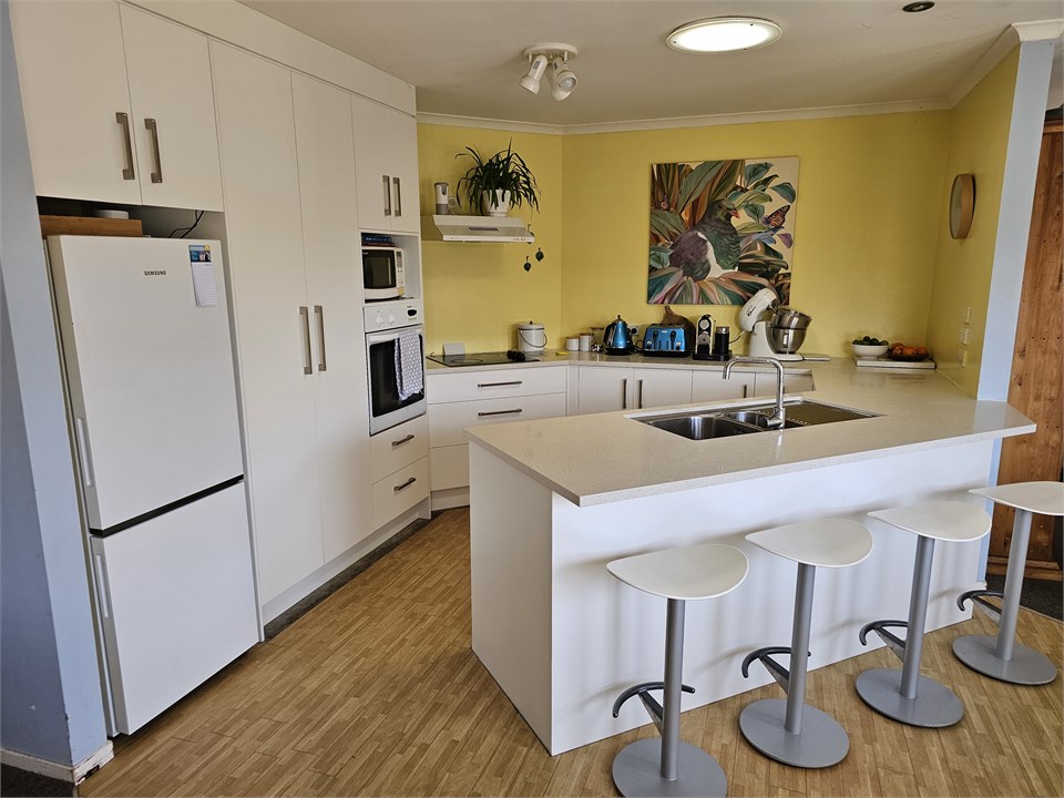 An open plan kitchen. Please note that the floorin