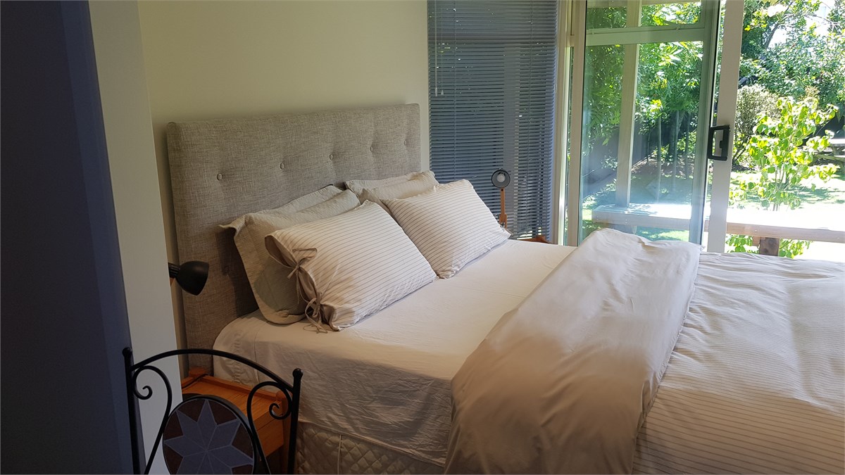 Open plan bedroom with its own deck