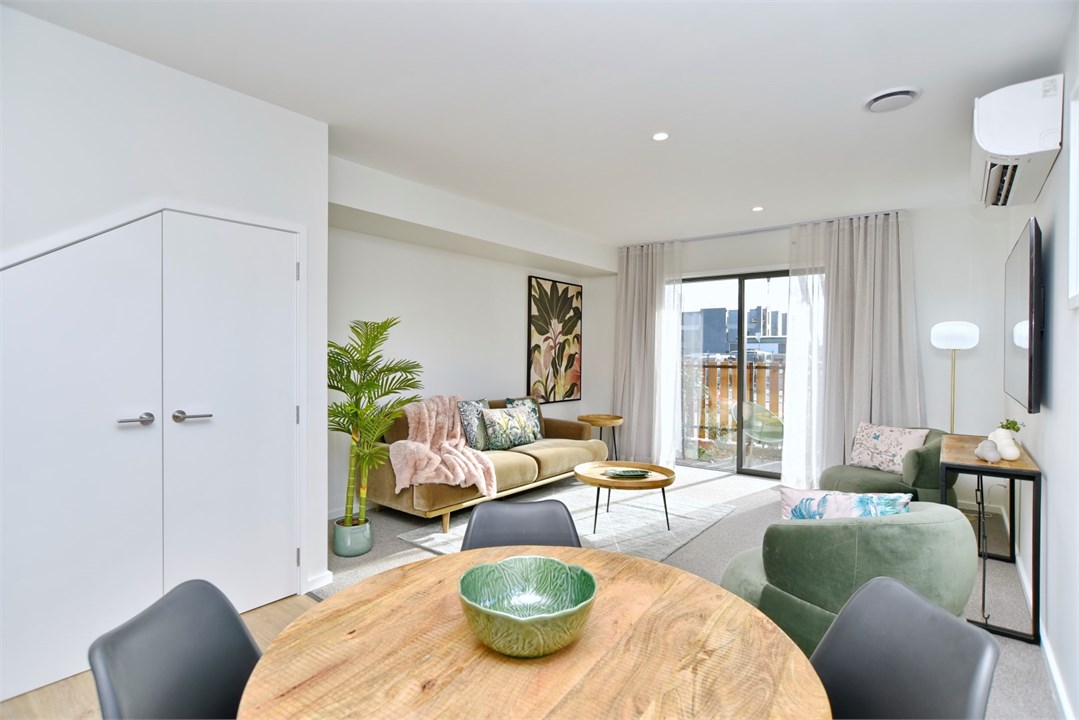 Living room with a TV and seating areas