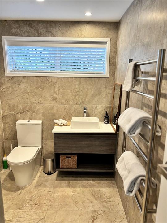 Bathroom with heated floor and towel rail