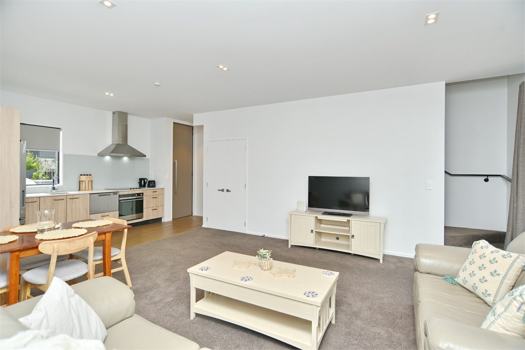 Living room has a TV and a seating area