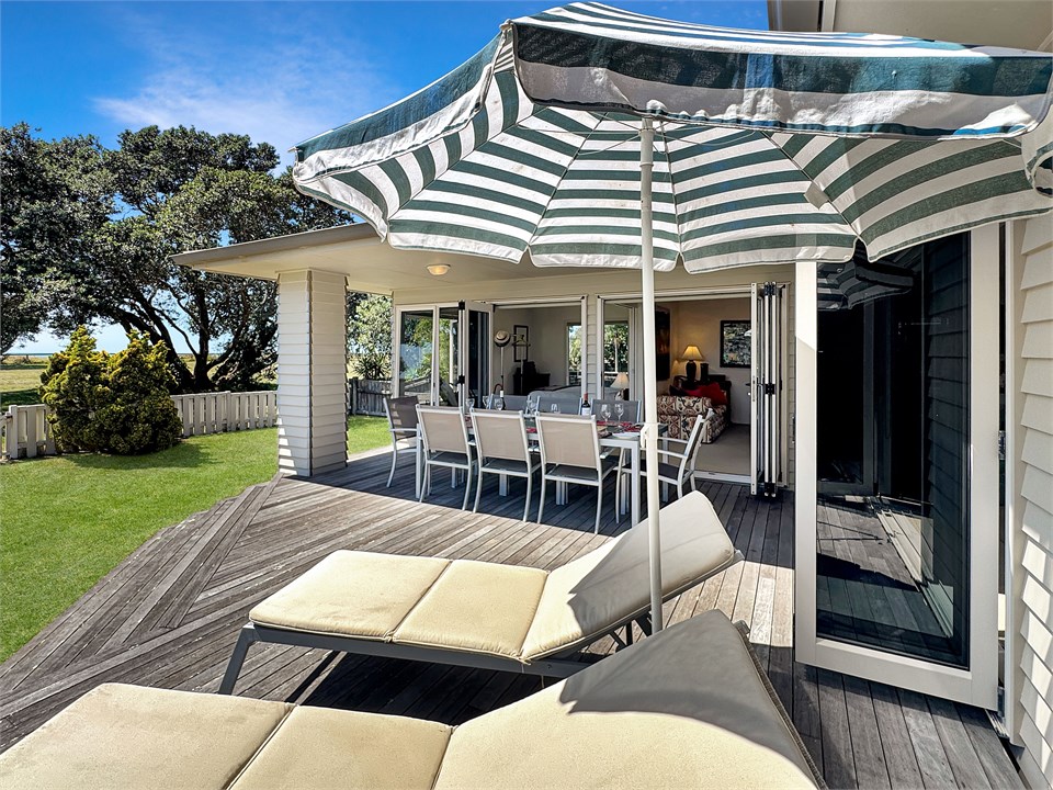 Sun beds and umbrella on the deck