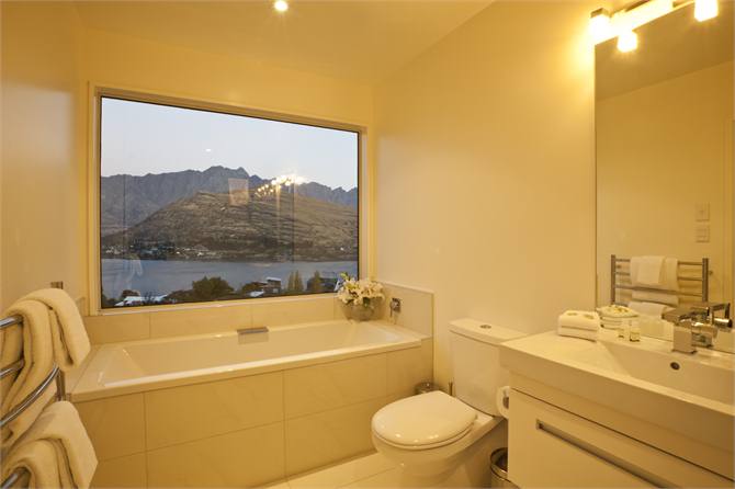 Ensuite of bedroom 4 with bath & walk in shower