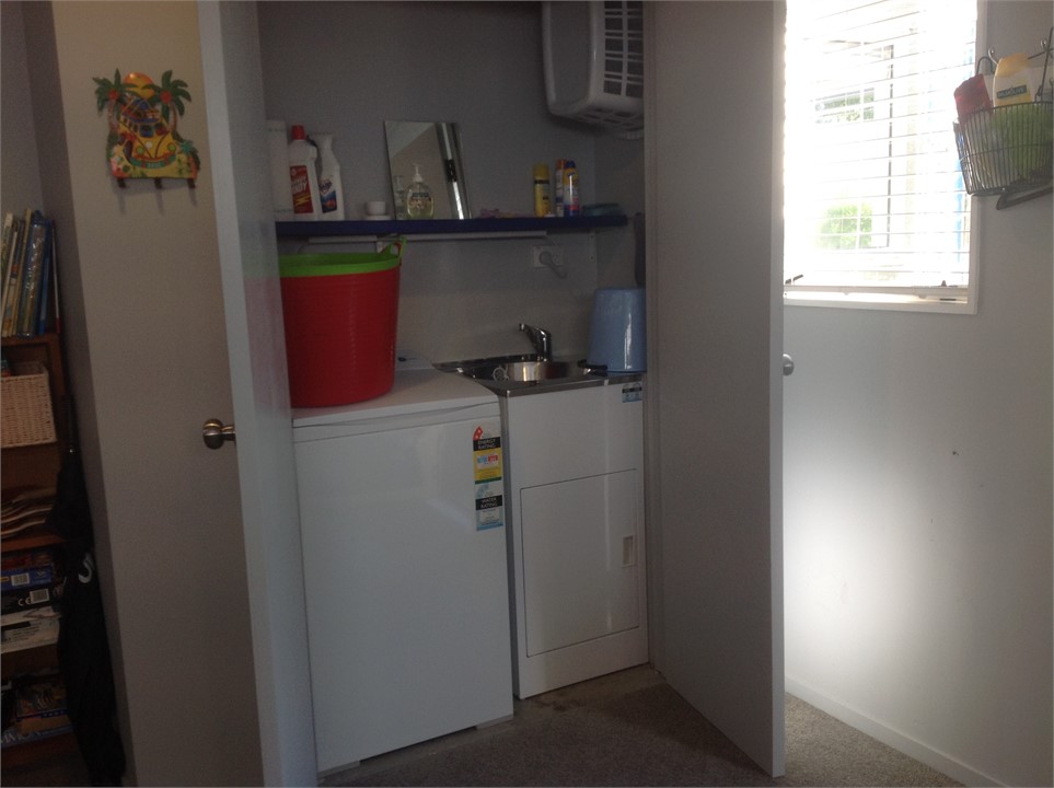 Laundry. Shares cupboard space in bunk room