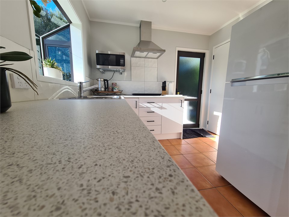 Kitchen with a family sized fridge/freezer