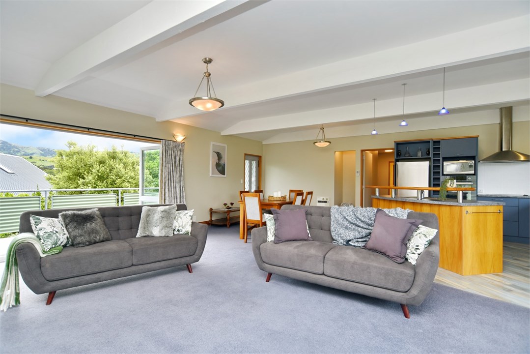 Living room has a TV and seating areas
