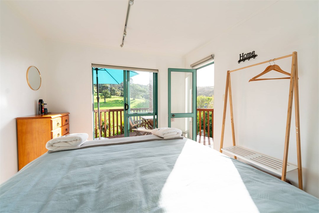 Bedroom downstairs with private deck