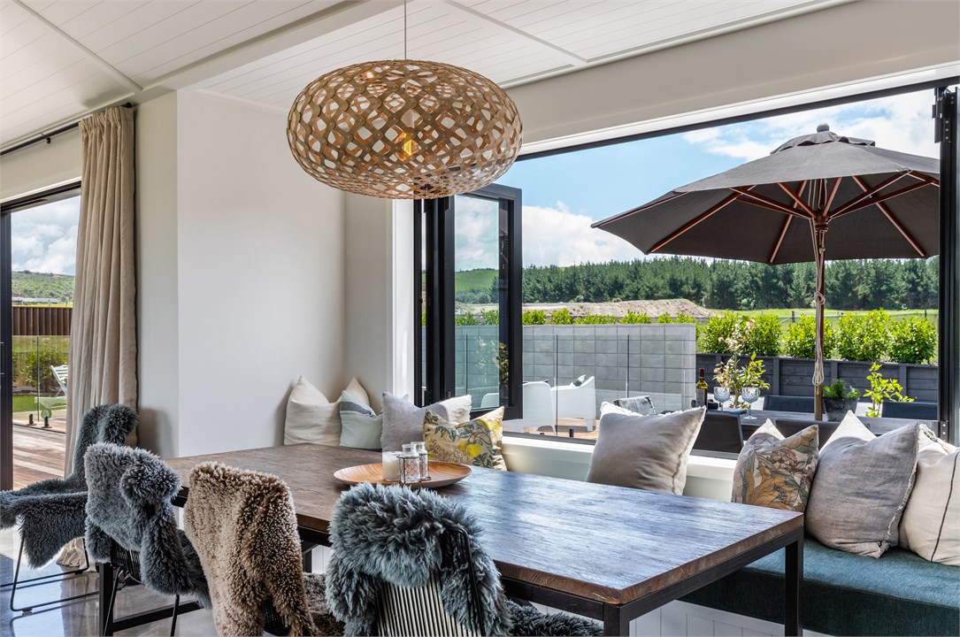 Dining area opening out to outdoor dining area