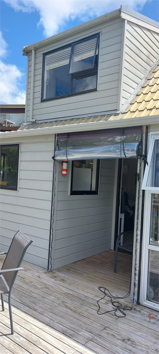 Looking back at house and closed in cafe area from