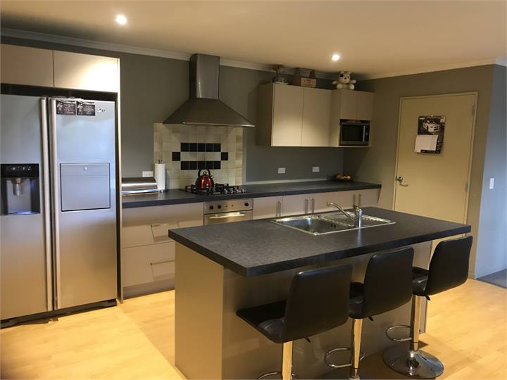 Galley style kitchen with gas hob, double fridge f