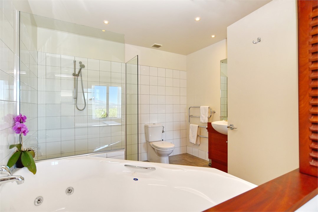 Ensuite to Bedroom 1 with a spa bath and shower